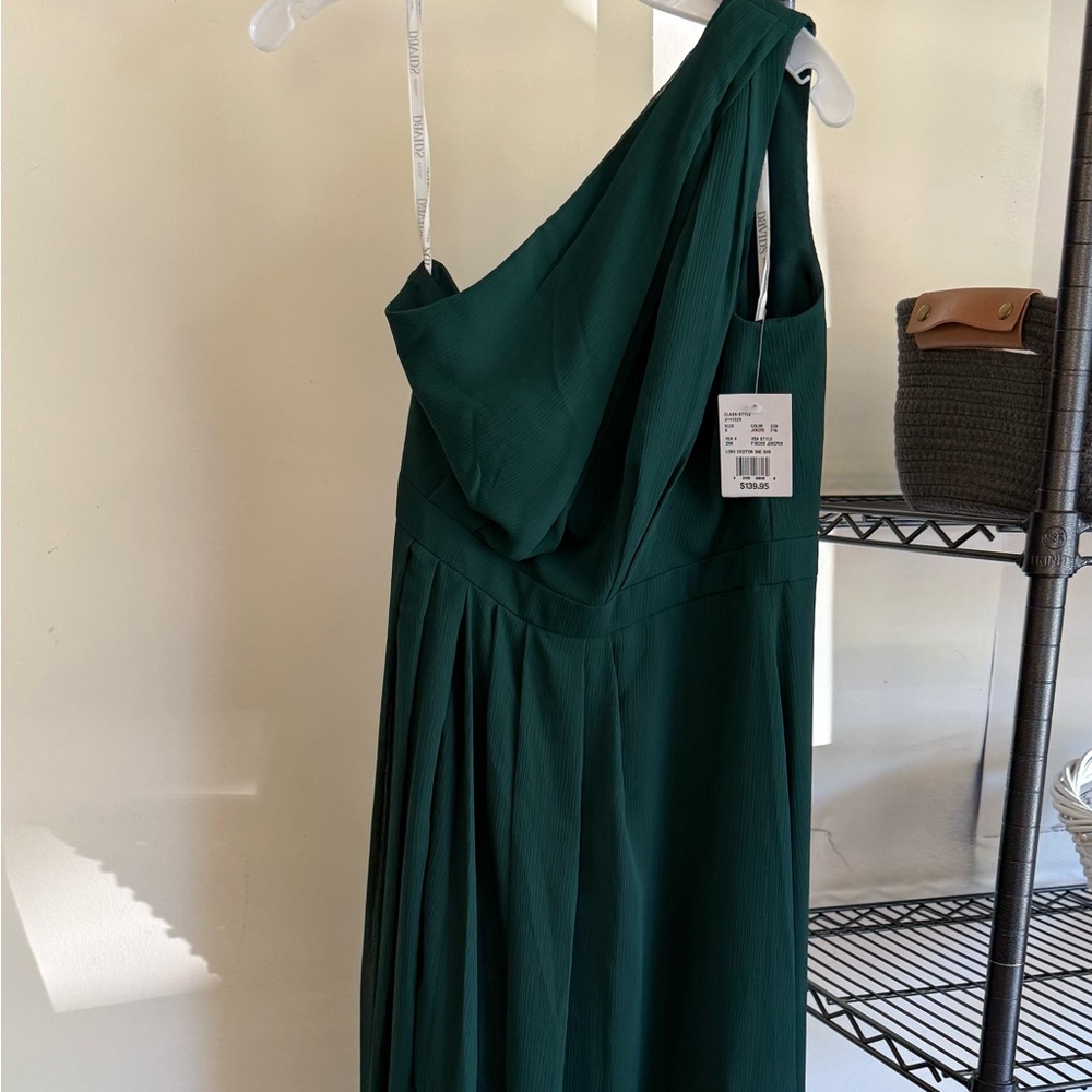 Green one shoulder gown. David’s Bridal, New.
